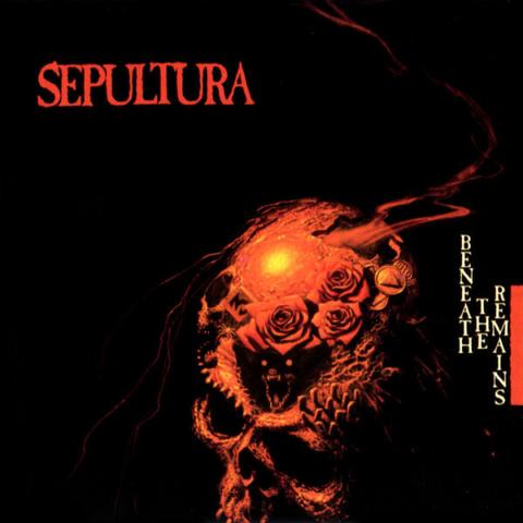 The album art is a crop of Michael Whelan's painting (in acrylics, over a pastel drawing) called "Nightmare in Red". It's an image of a skull in red, embedded with roses and other details such as what looks like gravestones, a tile with the number 3, and coins. Smoke seems to be coming out of a hole in the top of the skull, and a monster's face peers out of the dar