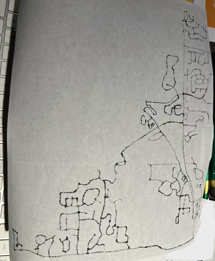 A white sheet of paper with traced roads showing through in black Sharpie