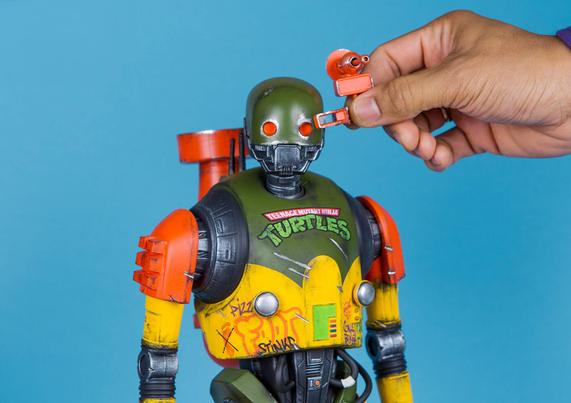 A custom robot toy painted in teenage mutant ninja turtles style.