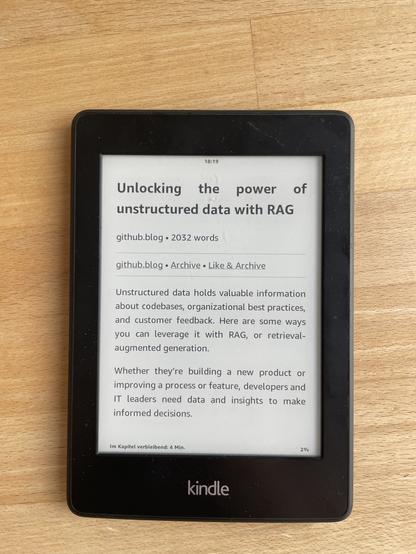 Photo of a Kindle Paperwhite displaying a saved article.