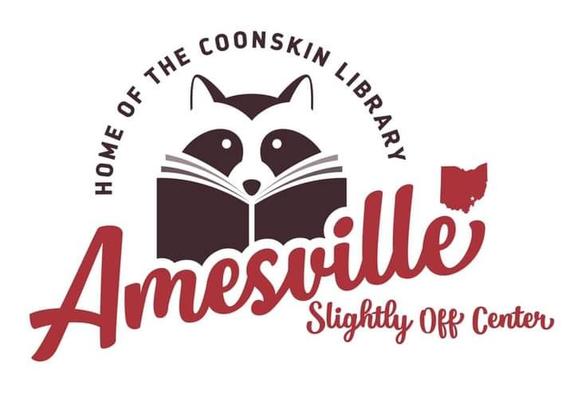 Picture of the Amesville logo, featuring a raccoon reading a book