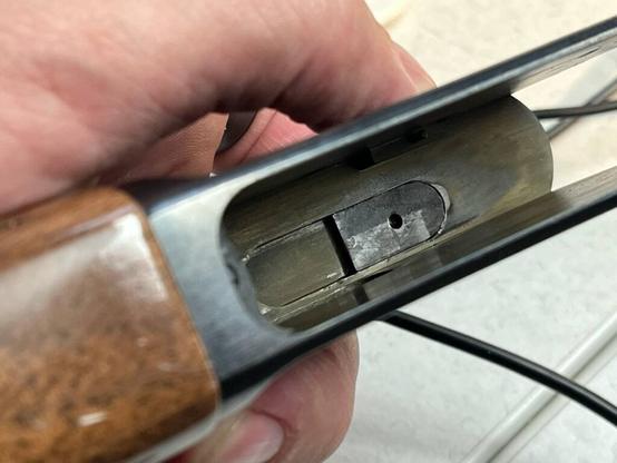 the inside of the action of a browning bl22 rifle.