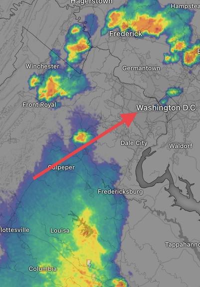 Weather radar shows a small shower passing over Washington, and a line of stronger thunderstorms approaching from the WSW