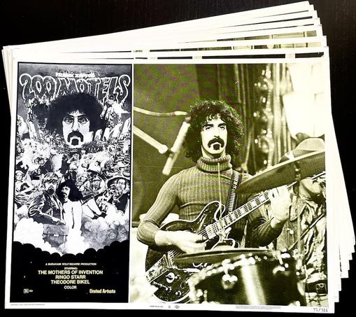 A stack of eight lobby cards from the 1971 United Artists movie '200 Motels', with musician Frank Zappa and his band The Mothers of Invention. On the top card, printed in sepia tones, Zappa appears in a photo holding an electric guitar - a still photo from the movie. Next to him is a black & white poster promoting the film. Other stars listed on the poster are Ringo Starr and Theodor Bikel.