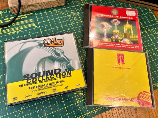 A photo of some CDs containing a load of audio samples. In the left is eJay Sound Collection #2 which contains 7,500 sounds in wave format across 4 discs. On the right is, at the top, is Shareware Universe’s Universe of Sounds containing thousands of MIDI, wav, mod and voc files, and below it, The Ded Good Music Library’s Techno-file CD.