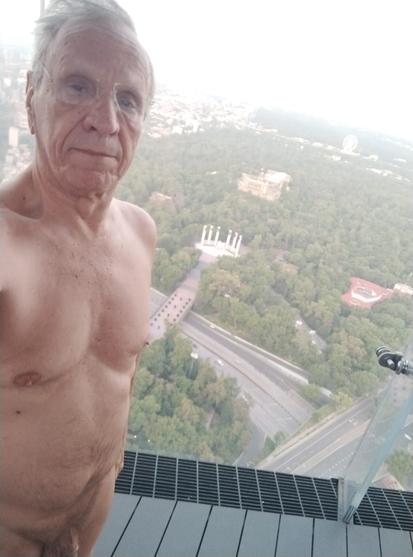 A selfie of Gerardo, nude, looking down on Chapultepec park.