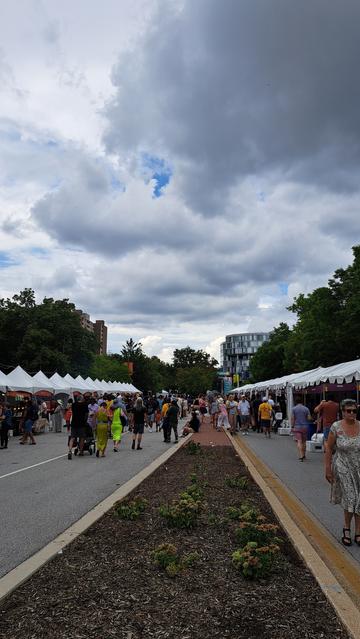 Clouds stage people median street.