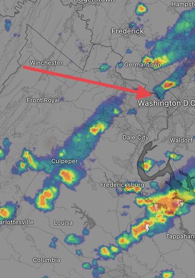 Weather radar shows a thunderstorm passing just north of Washington, with a few other thunderstorms in the general area, coming from the WNW