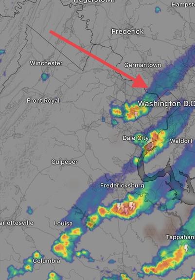 Weather radar shows a band of light rain moving over Washington from the WNW