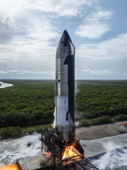 Photography of SpaceX Starship ship prototype number 30 during static fire test.