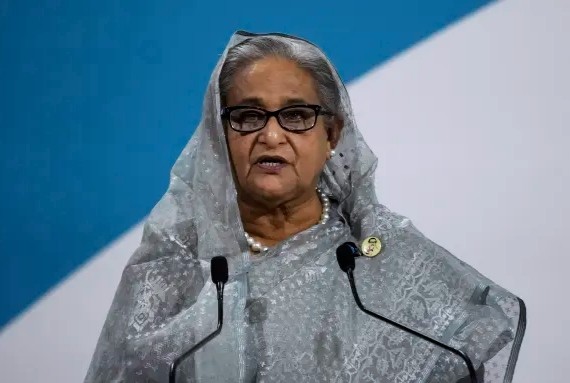 Crowds of protesters on Monday stormed the official residence of Bangladesh's Prime Minister Sheikh Hasina, pictured in November 2021. Christophe Ena/AP