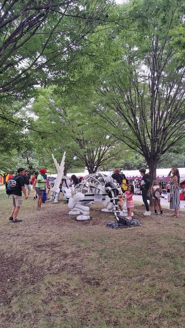Fake dino bones used as percussion. 
Dirt 
Trees
People