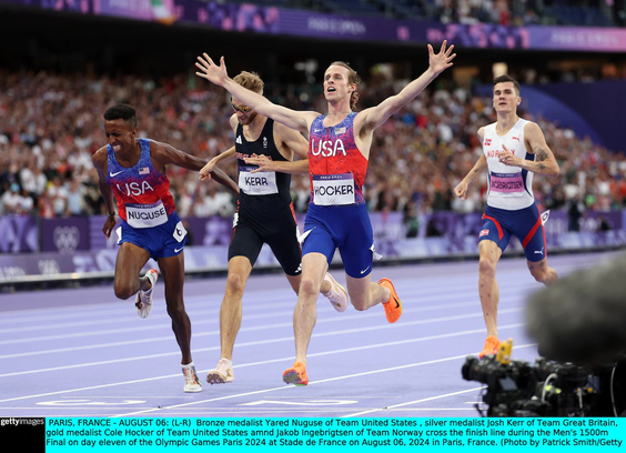 Color image, photographer Patrick Smith, Getty Images, August 6, 2024, Team USA Cole Hocker wins gold and Yared Nuguse bronze, as dueling favorites Josh Kerr of Great Britain wins silver by 0.01 seconds, and favorite Jakob Ingebrigsten finishes off the podium a fading fourth.