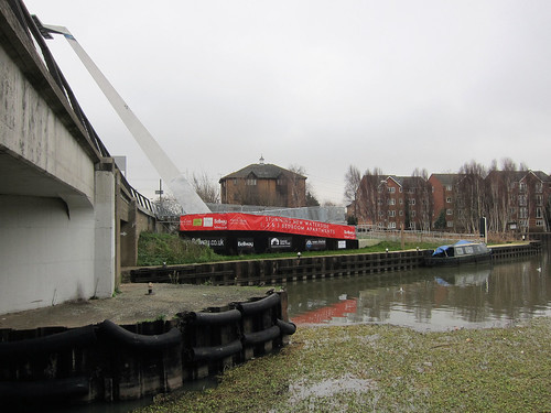 A photo titled "Our river, Bellway's billboard", taken near Bridge 23A, Pimms Brook Towpath Bridge by Alan Stanton on Flickr.