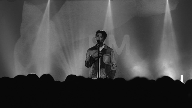 Black and White image of RM, onstage at Rolling Hall in Seoul