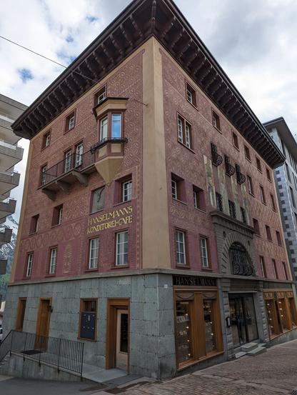 Hanselmanns Konditorei-Cafe. A beautiful old building housing a bakery and a cafe. It's red, with dark orange geometrical patterns.