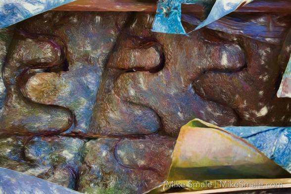 Abstract photo of the inside of a sofa dumped along the river bank.