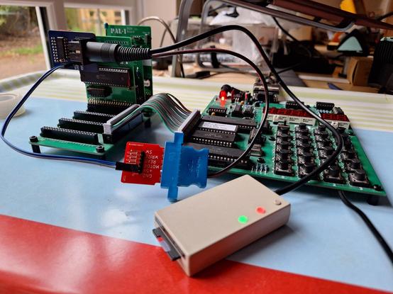 An SD2IEC drive connected to a PAL-1 computer with an IEC serial interface gadget. The SD2IEC drive is powered from the IEC interface using an adapter that has a VIC20 cassette port edge connector.