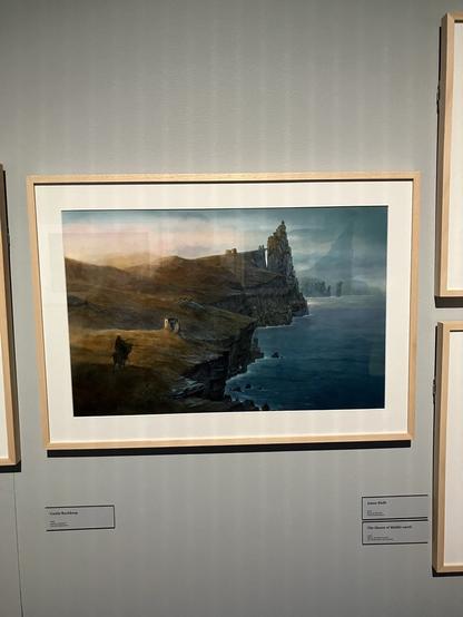 Painting of a shoreline with a castle in the distance and a lonely rider in the foreground. Cover art for Robin Hobb’s Assassin’s Apprentice by John Howe