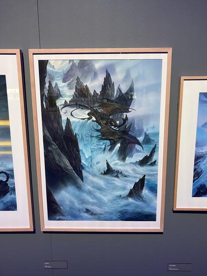 A painting of two  dragons fighting over an icy sea cliff. Cover art for Robin Hobb’s Fool’s Fate by John Howe.