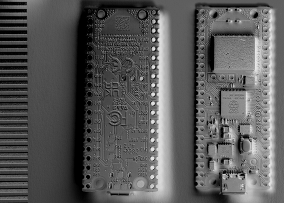 Image of the front and back of a Raspberry Pi Pico W (1st Generation) circuit board.