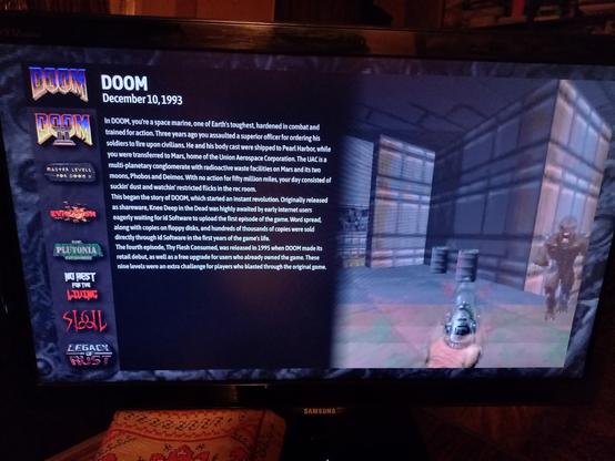 The Startup screen of Doom + Doom II, featuring all the official classic episodes, and the newest episode by Nightdive, Legacy of Rust.