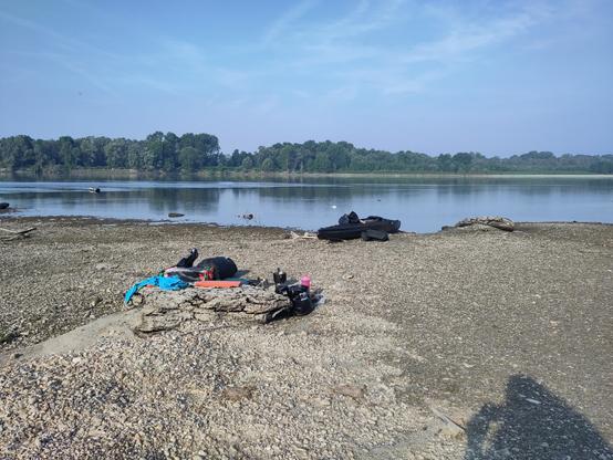 a sandbank the po river shortly after the ticino join a folding kayak on it and some breakfast