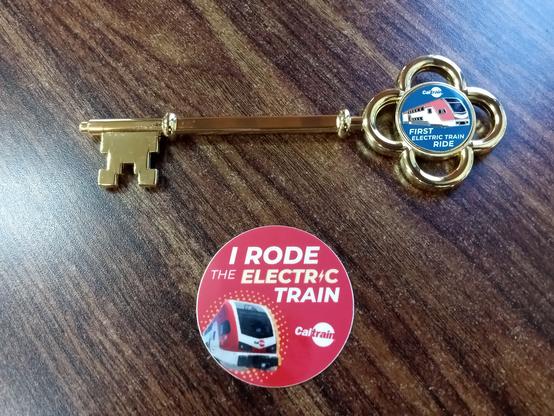 A commemorative key and a sticker