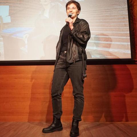 One person on stage dressed in all black.