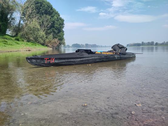 A klepper T9 folding kayak at a beach at the po river.
