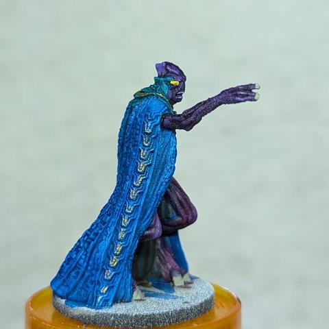 The same miniature from the side.  Some gold ornamentation can be seen.