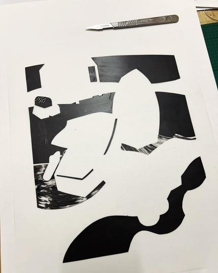 A hand made stencil for a screenprint, made from polyester sheet cut out in various shapes and painted black.