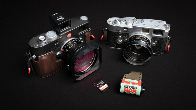 Two Leica cameras side by side, one has a memory card in front of it and the other one analog film