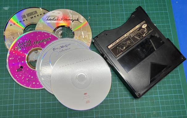 Five CDs placed next to a Pioneer six-CD changer cartridge. The CDs are from Van Morrison ("Astral Weeks"), Chantal Kreviazuk ("Under These Rocks and Stones"), David Clayton-Thomas ("Blue Plate Special"), Tara MacLean ("Silence"), and Amanda Marshall (self-titled).
