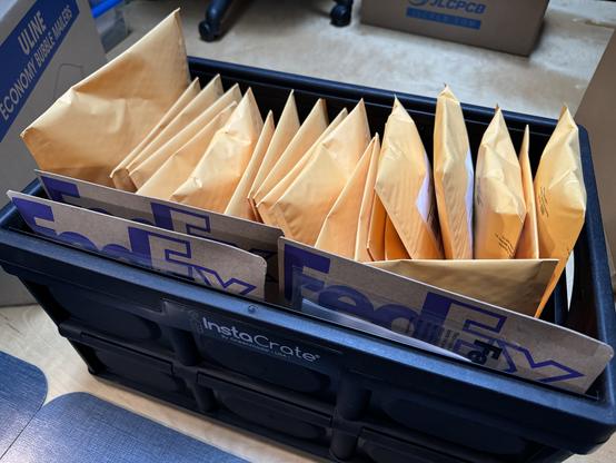 Box full of padded envelopes.