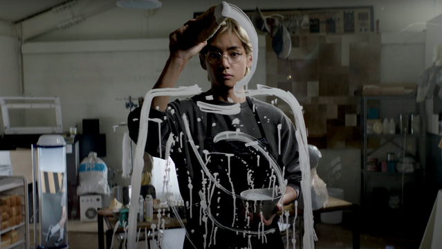 Taehyung in the Rainy Days MV. He's painting a self portrait on glass.