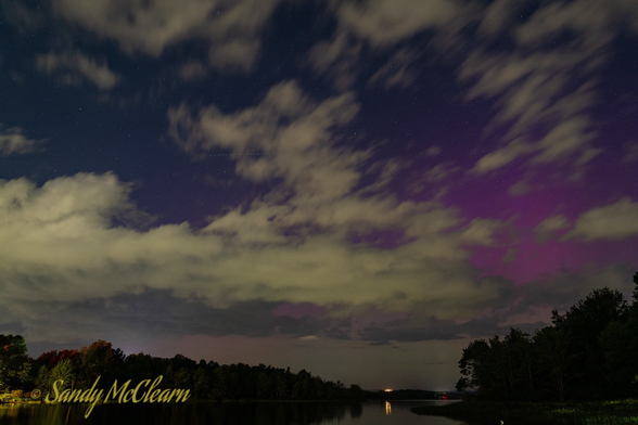 Cloudy night sky with some purple colouring.