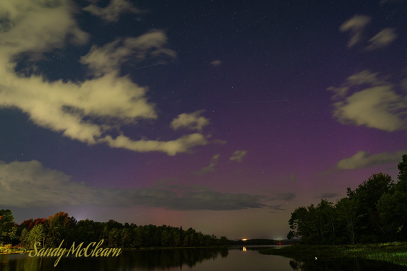Cloudy night sky with some purple colouring.