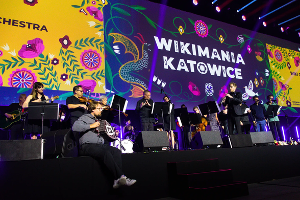A group of classical musicians performing on a stage.