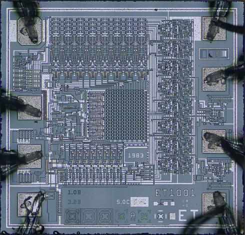 A decapped chip from a payphone card, marked ET1001.