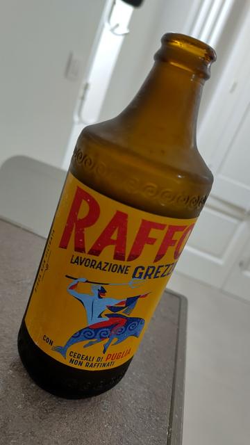 A bottle of very cold raffo beer.