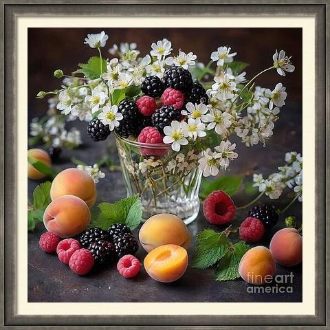 White flowers are arranged in a glass, interspersed with blackberries and raspberries. Peaches and additional berries are scattered around the arrangement against a dark backdrop.
