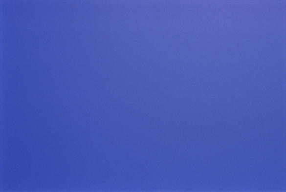A zoomed in photograph of a clear blue sky, slight variations give it almost imperceptible dynamics but, to a quiet glance, it appears as a plain blue colour field.