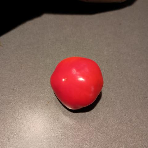 A small red pepper called pimiento or pimento. They are more flavorful than the red bell pepper in my opinion.