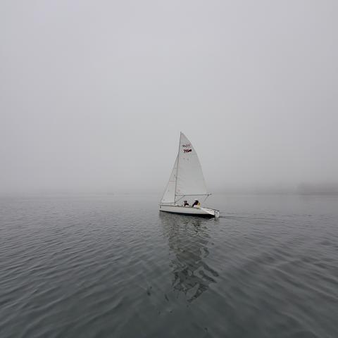 Sailing on foggy ocean on Martin 16, 2 seater sailboat. Mom is in stern seat behind me.
