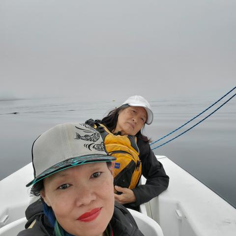 Selfie of me & Mom in stern passenger seat. Background is foggy ocean.