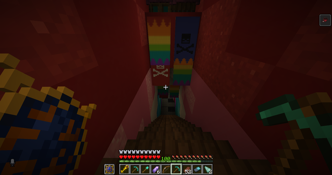 Screenshot of Minecraft showing staircase going down. Above the stairs there are a couple of banners - at least 4 of which are rainbow flags. There are also banners with skull and bones on the side of those.
