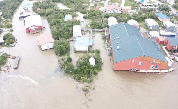 aerial photo - drone image shows floodwaters threatening the William Miller Memorial School in Napakiak on Sunday, Aug, 18, 2024