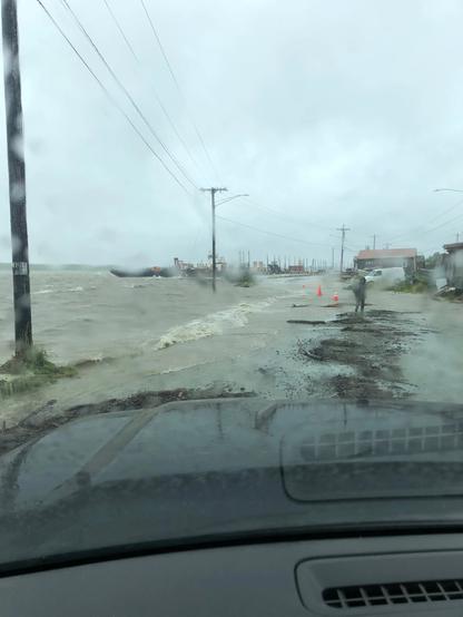 photo - Kuskokwim River spills over the Bethel riverfront amid high winds on the afternoon of Aug. 18, 2024.