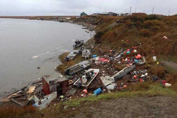 photo - example of damage from a previous storm - Boats and debris litter the shoreline of the Ningliqvak River after the storm surge from Typhoon Merbok brought high water 17 miles inland to Chevak from the Bering Sea coast